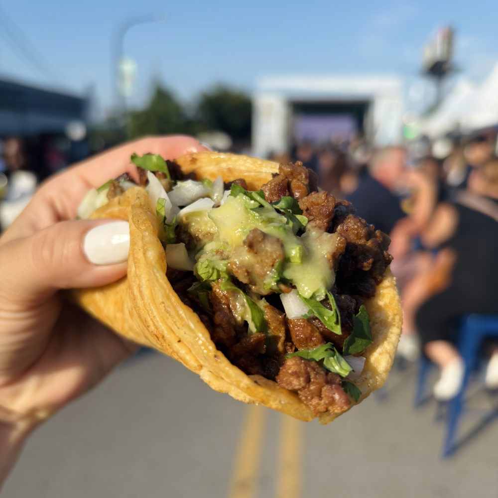 hand holding taco at tacoville naperville